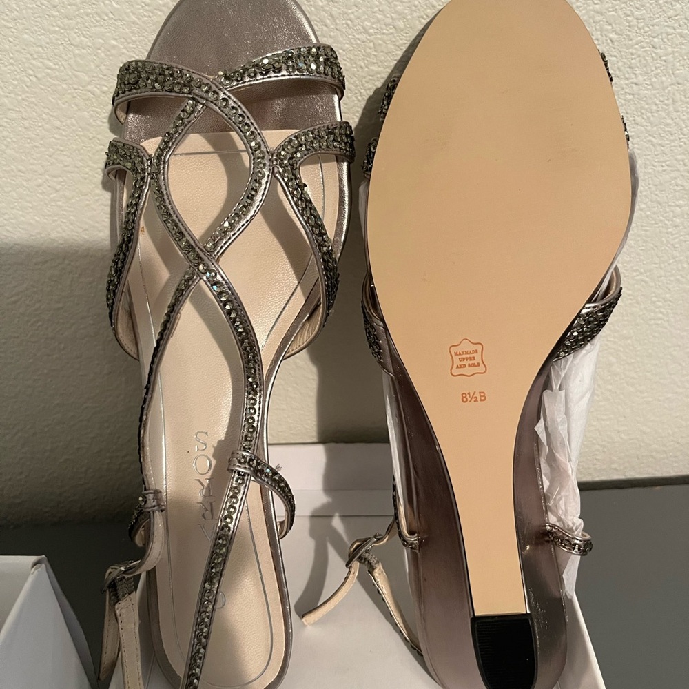 Brand new still in box dress wedges.  Mushroom metallic color